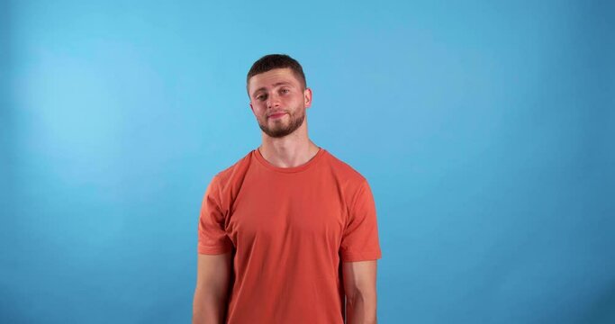 Emotional young man on light blue background