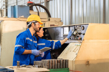 Team of engineers practicing maintenance Taking care and practicing maintenance of old machines in the factory so that they can be used continuously...