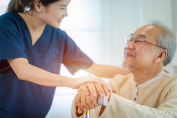 Fototapeta premium Caregiver talking to senior man in bedroom,Medical help trust support encourage reassure patient,Home care service.