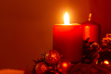 Burning candle and christmas decoration