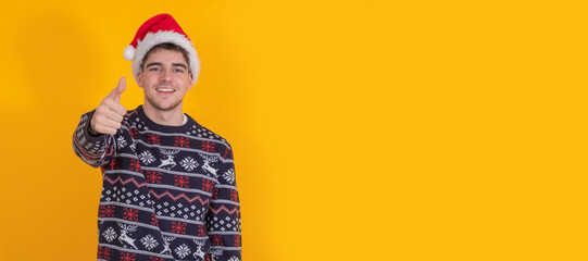 Obraz premium isolated boy with christmas clothes and santa claus hat