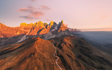 Pale di San Martino mountains during sunset. Aerial view. Rolle Pass, Trento Province, South Tyrol, Italy. - 551780445
