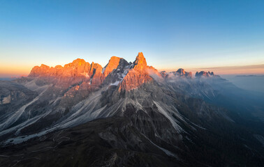 Pale di San Martino mountains during sunset. Aerial view. Rolle Pass, Trento Province, South Tyrol, Italy. - 551780631