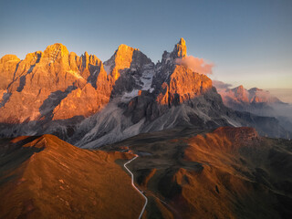 Pale di San Martino mountains during sunset. Aerial view. Rolle Pass, Trento Province, South Tyrol, Italy. - 551780676