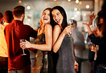 Friends, new year and party celebration, drinks and happy smile with dance, music and ladies night social. Women, laugh and celebrate at a event with people, drinking alcohol and nightclub tgoether