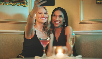 Girl friends, phone and selfie at a nightclub for cocktail celebration with happy women and alcohol. Mobile photo, smile and restaurant drinks of people at a event for new year or happy hour