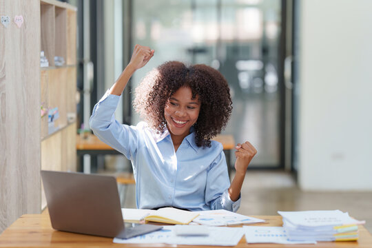 Black Businesswoman Work On Laptop Feel Euphoric Winning. Excited Female Triumph Get Good News From Work