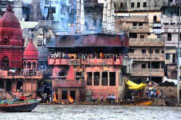 View of the main monuments and tourist spots of Varanasi (India). Holy river Ganges (Ganga). Crematorium. Ghats