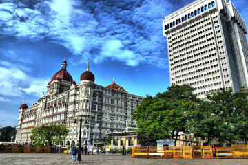 View of the main monuments and tourist spots of Mumbai (India). Colaba neighborhood. English colonial style buildings (19th century). Hotel Taj Mahal