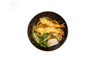 Top view of Delicious Japanese Udon ramen with shrimp tempura in bowl, focus selective.