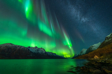 Fototapeta na wymiar Colourful northern lights and Milky Way near Tromso, northern Norway