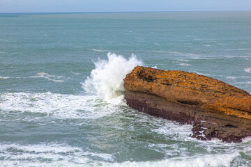 waves crashing on rocks