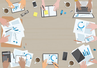 Hands of people with variety of skin tones, actions and devices around wooden table for business meeting concept from top view