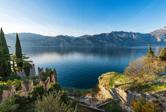 Panoramic view of Lake Garda (Lago di Garda) and Italian Alps, from the small town of Malcesine, Verona province, Italy, Veneto, southern Europe. On background the coast of Lombardy.
