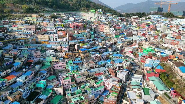 Busan: Aerial view of city in South Korea, famous Gamcheon Culture Village, kaleidoscopically coloured village on sunny day - landscape panorama of Eastern Asia from above 