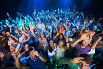 Dance, music and party with audience at concert for rock, festival or disco with live band...