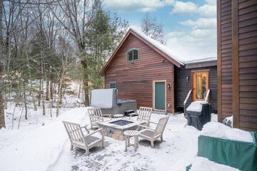 Empty chairs in the yard of the house in winter.