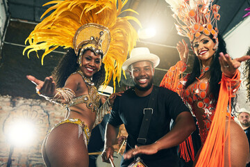 Carnival, brazil and band with woman dancers outdoor together for a new year celebration in rio de janeiro. Portrait, party and event with a man and female performance artists celebrating tradition