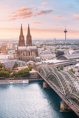 Cologne Aerial vertical view with trains move on a bridge over the Rhine River on which cargo...