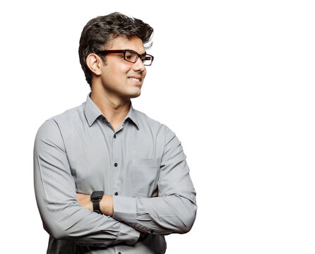 PNG Photo of an attractive bossy young businessman with crossed arms friendly smiling looking at colleagues, empty space wearing specs isolated transparent background.
