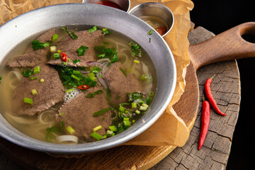 Noodles with beef, green onions and chili peppers