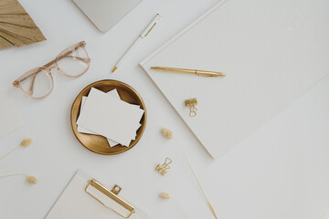 Paper card sheet with blank mockup copy space, gold colour stuff on white background. Aesthetic...
