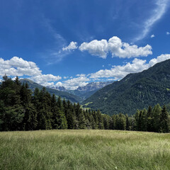 Fototapeta na wymiar Scenic view of mountains, valley, forest, sky with clouds. Landscape