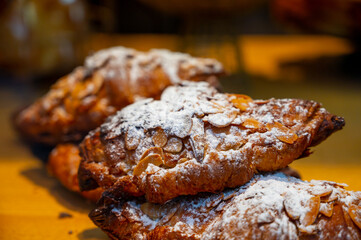 French sweet dessert pastry with almonds on display in french bakery