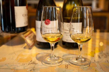 Tasting of white dry chablis wine in small winery in Chablis town, Burgundy, France