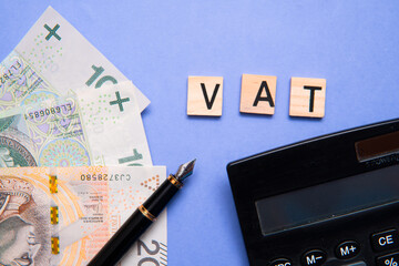 inscription Vat next to the polish zlotys. Vat means value-added tax. - obrazy, fototapety, plakaty