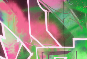 Colorful background of graffiti painting artwork with bright aerosol strips on metal wall. Old...