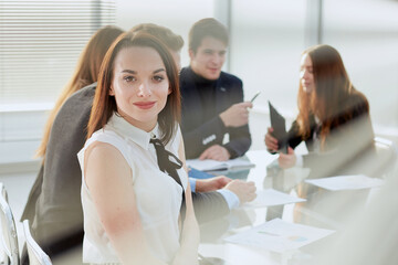 young business woman sitting at an office Desk.