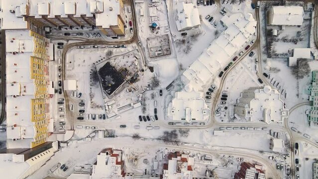 Aerial view of an urban residential area in winter, with snow all around. New buildings in a modern metropolis. Solution of the housing problem. City of Vladimir, Oktyabrsky district. UHD 4K.