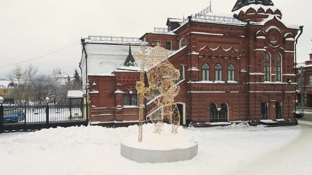 Lion from luminous garlands, outdoor Christmas sculpture. Installation, king of animals in a crown and with a staff, coat of arms. City of Vladimir, Cathedral Square, Russia. UHD 4K.