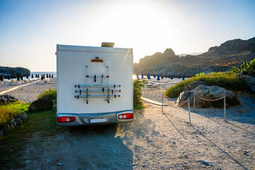 Motorhome parked on amazing Skinaria beach, Crete, Greece.