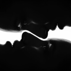 Close-up collage dark faces silhouette of beautiful and sexy woman. Part of model face illuminated with light. Mirror effect applied. Sensual mood. Eye is in camera focus. Black and white image