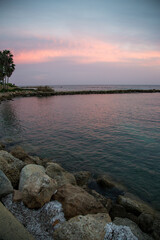 Fototapeta na wymiar Sunset over a small bay, Paphos, Cyprus 