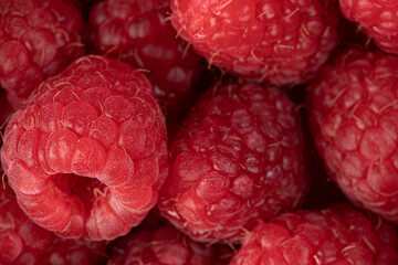 Raspberries. Fresh juicy raspberries bright background. Close-up.