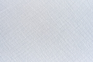The texture of the wrinkled white fabric