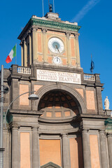 Clock of Dante's Square in Naples seen from first sight, on a sunny day.
