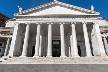 Entrance to the church from the Plebiscito square in Naples, on a sunny day.