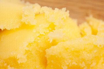 Homemade melted ghee clarified butter close up macro food background