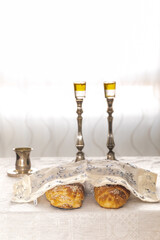 Shabbat image - silver candlesticks Lightened with olive oil, Silver kiddush cup and challah