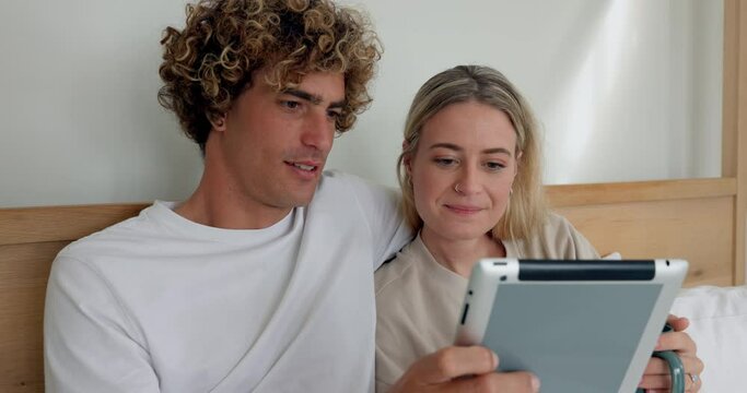 Couple, tablet and drinking coffee in bed while browsing for social media meme and content. Media, wifi and girlfriend and boyfriend relaxing in bedroom while using the internet and streaming