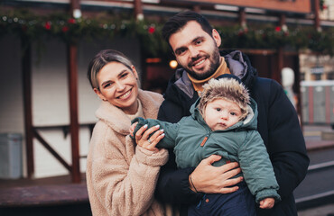 family on the street in christmas town