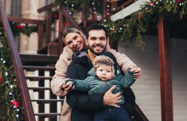 family on the street in christmas town
