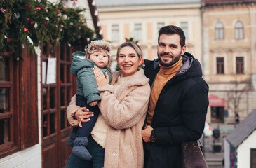 family on the street in christmas town