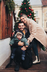 family on the street in christmas town