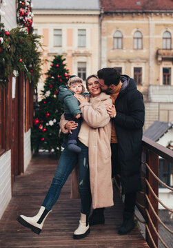 family on the street in christmas town
