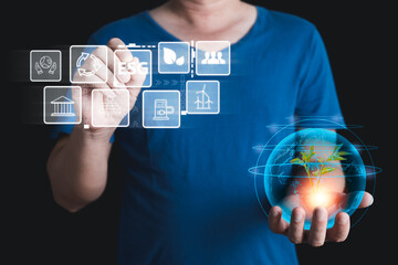 hand touch hologram to save energy,and reduce global warming,climate change,ecology friendly investment,ESG environment social governance,Green Business Innovation and Sustainable Development concept.